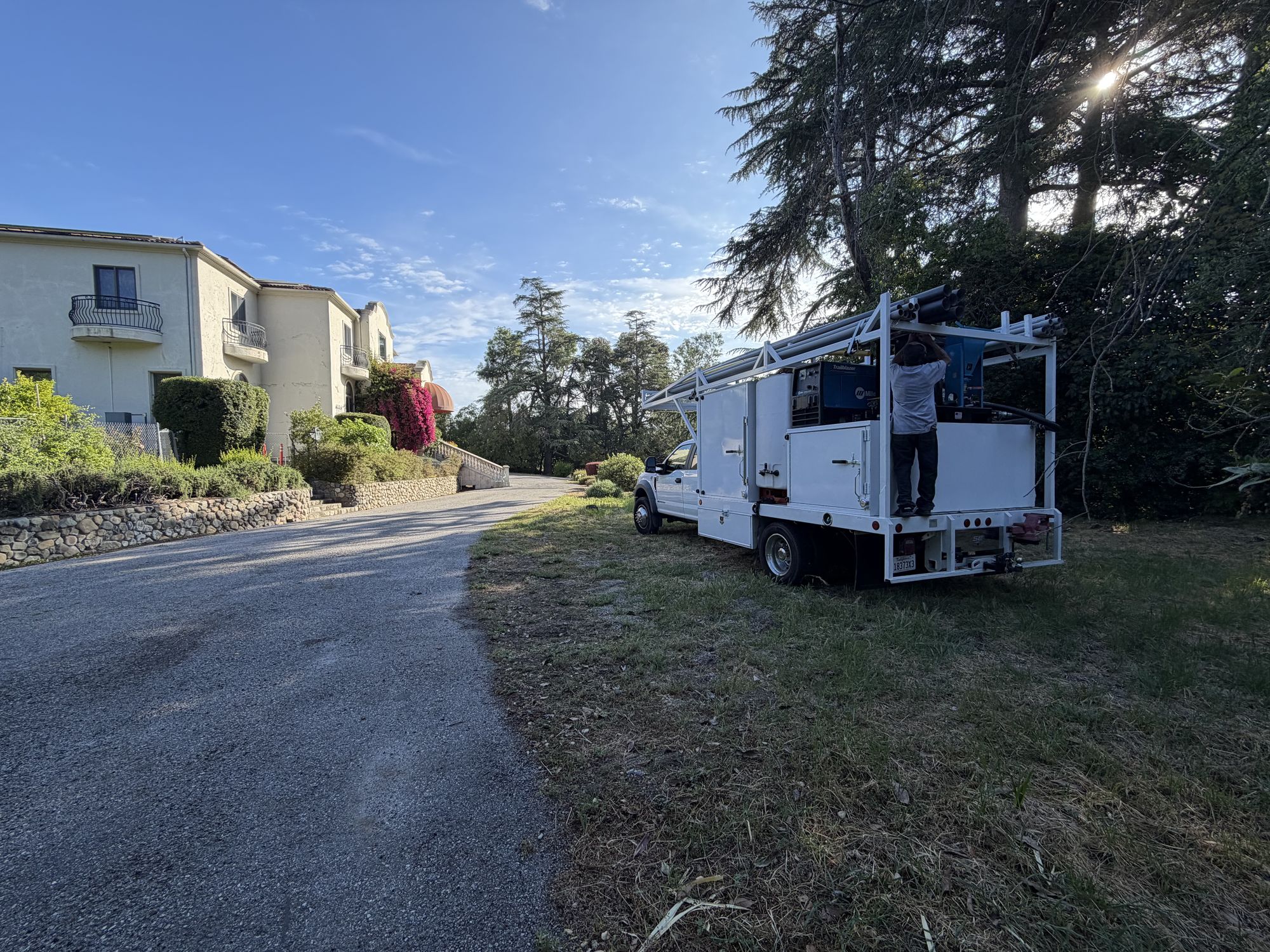 Apex hydrovac truck parked on the drive of a Los Gatos hillside estate