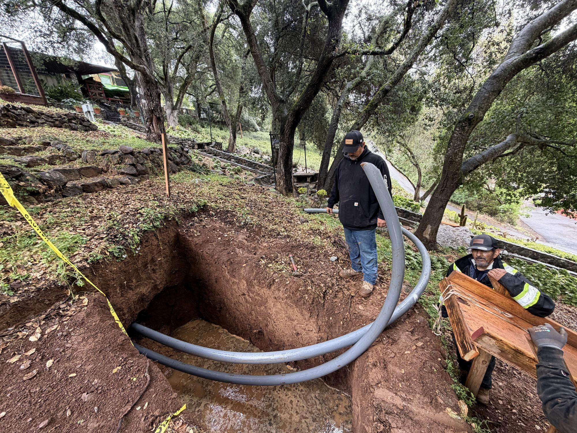 Crew feeding conduit into the exit pit