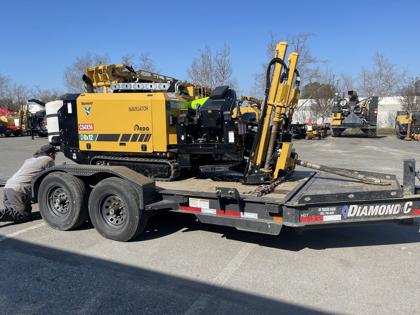 Yellow Vermeer drill loaded on a trailer ready to mobilize