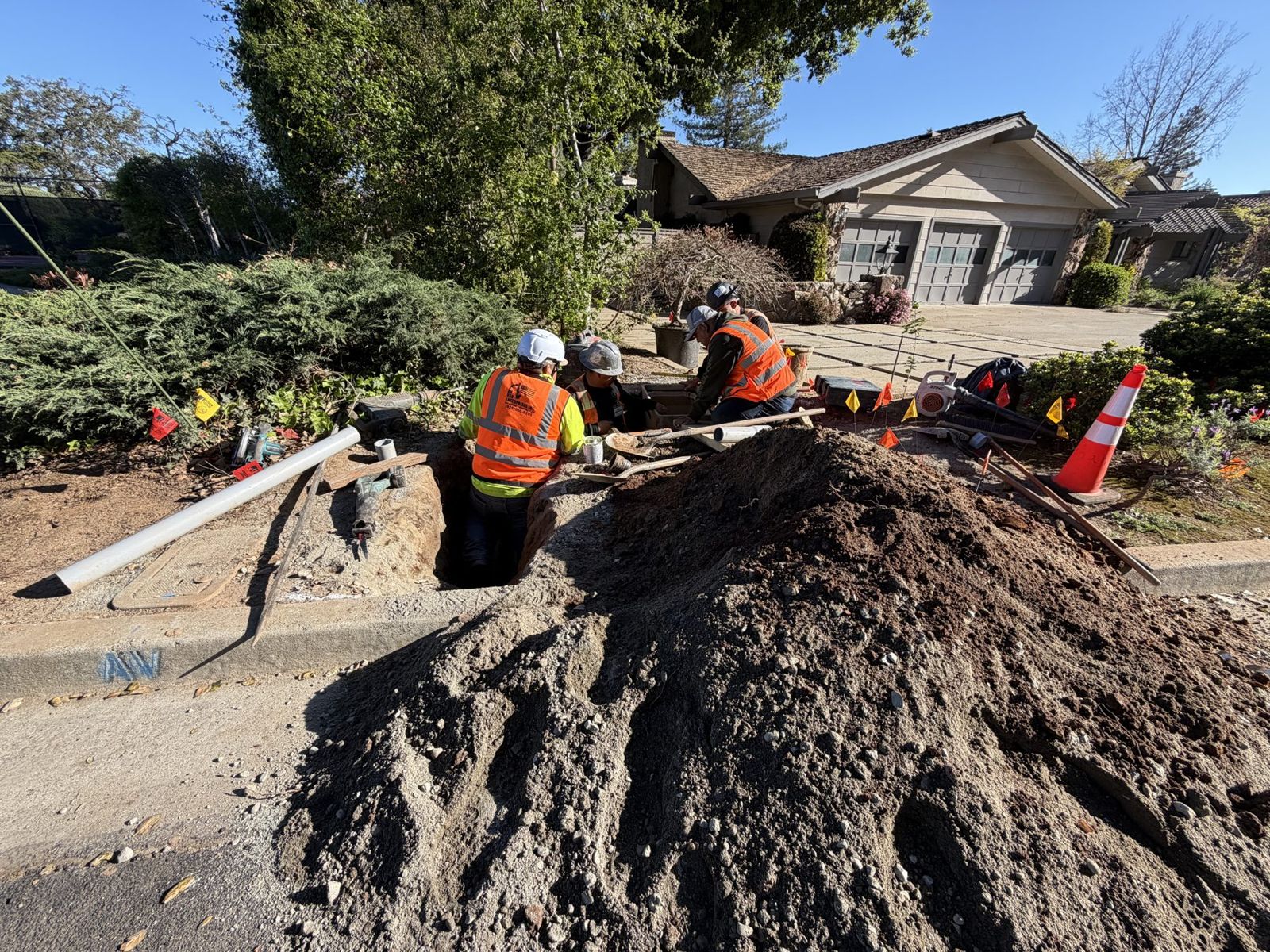 Crew at a small exit pit in a front yard